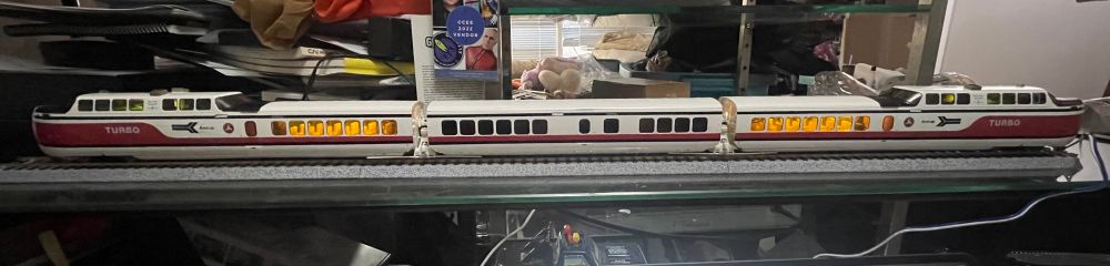 Amtrak TurboTrain in the early scheme which is mainly white with red and black stripes, and black lettering.