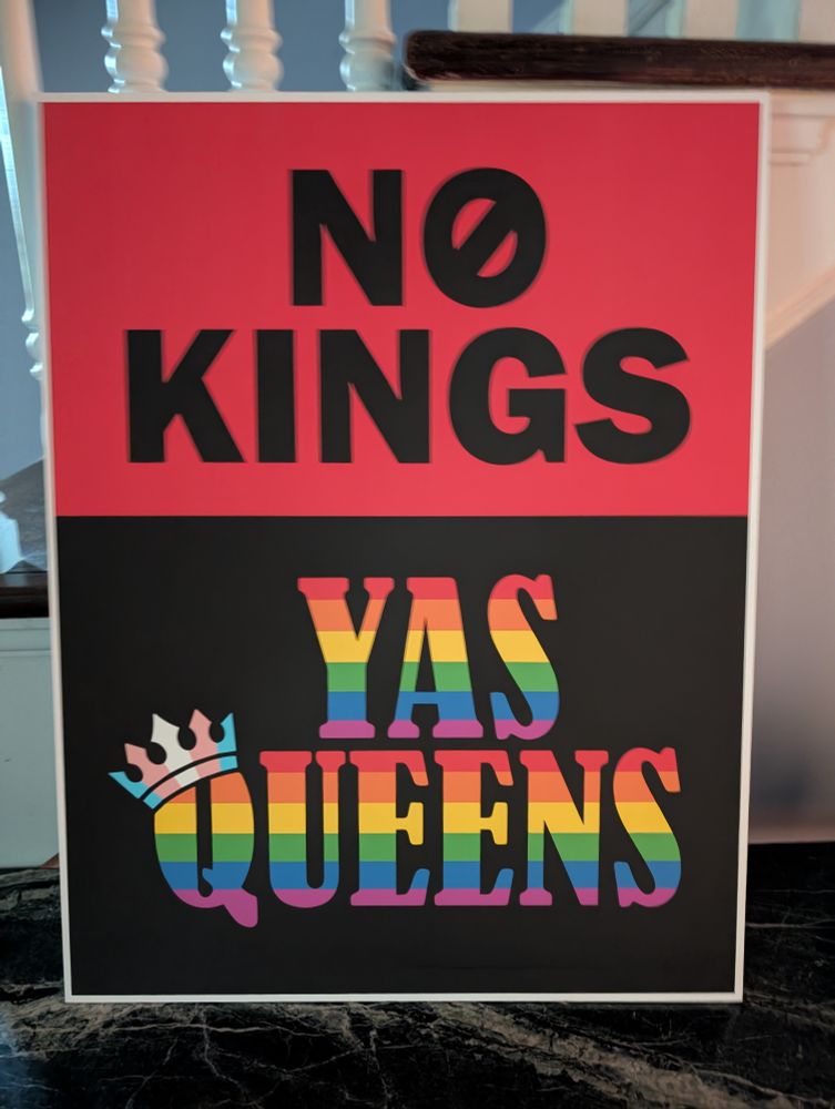 Sign that says "No Kings, Yas Queens" with rainbow letters