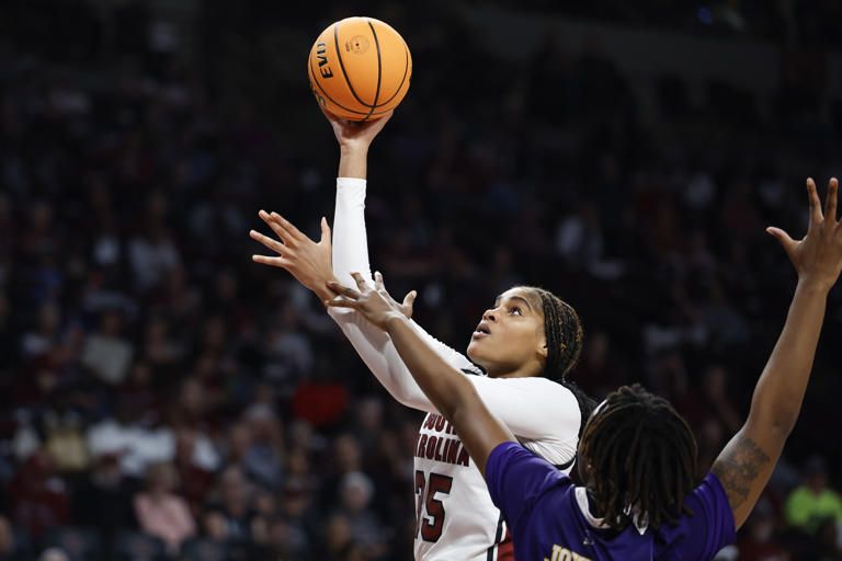 South Carolina center Sakima Walker (35) shoots against East Carolina forward Amiya Joyner, right, during the second half of an NCAA college basketball game in Columbia, S.C., Sunday, Nov. 17, 2024. (AP Photo/Nell Redmond)