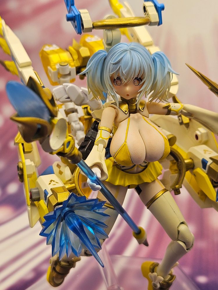 Another shot of Ginger. In this one, her armor is reconfigured and folded back, exposing her body along with transforming her skirt's thusters into a pair of blasters. Now, Ginger poses thrusting her staff forward while firing her thruster-blasters.