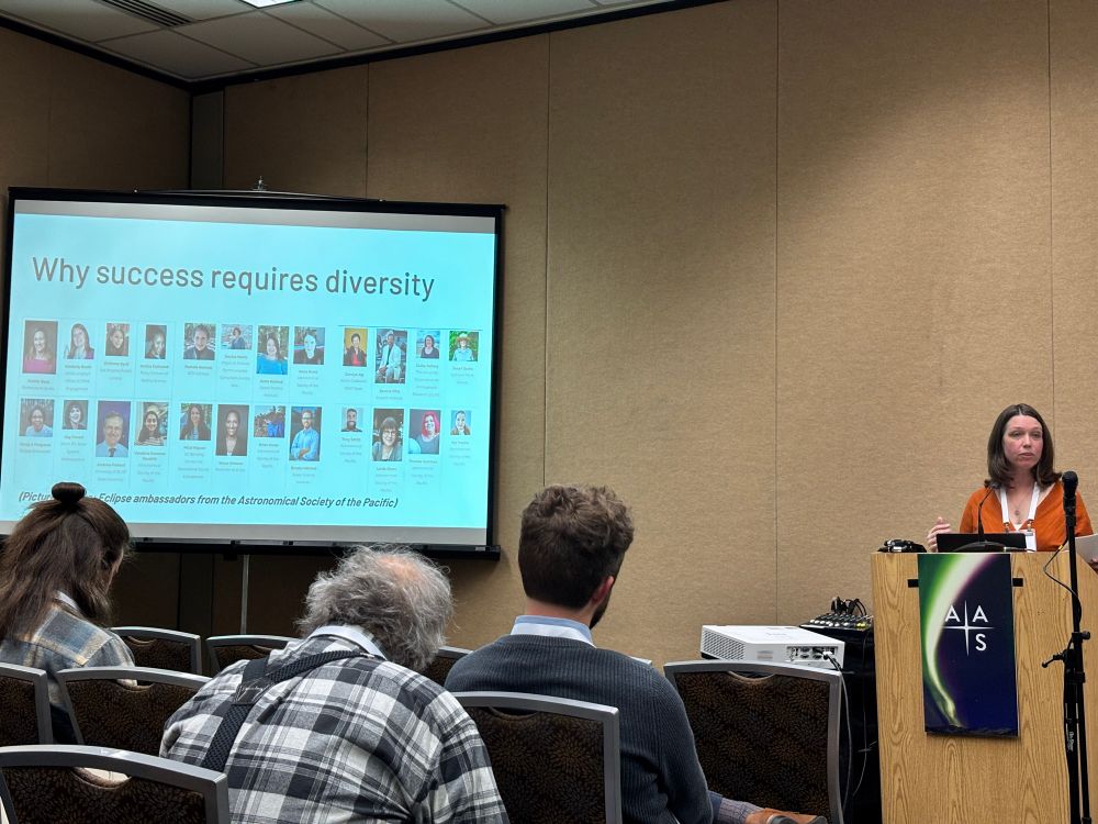 A woman at a podium addressing an audience with an image of people on a projector screen along with text that says "Why success requires diversity. (Pictured above: eclipse ambassadors from the Astronomical Society of the Pacific."