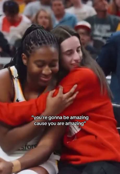 Caitlin Clark hugging Aliyah Boston at a Fever basketball game with the caption “you’re gonna be amazing cause you are amazing”