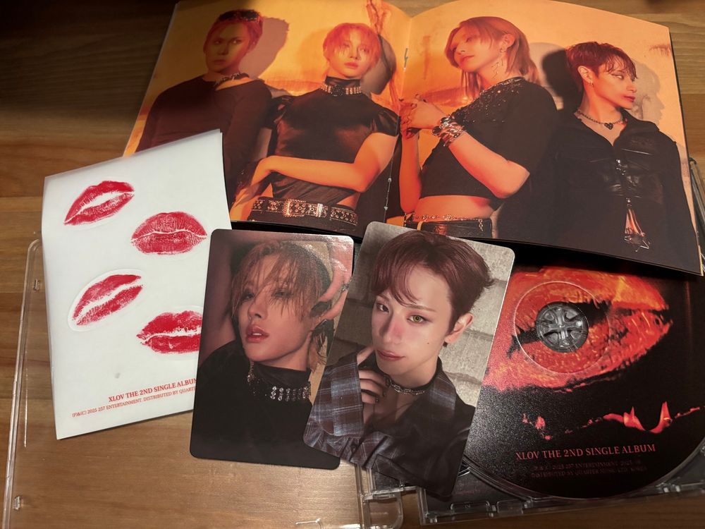 XLOV second single album jewel case, with lip print stickers. Photocards are Rui and Haru. 