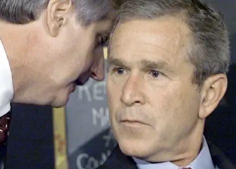 Advisor informing George W Bush about the attack on the World Trade Center