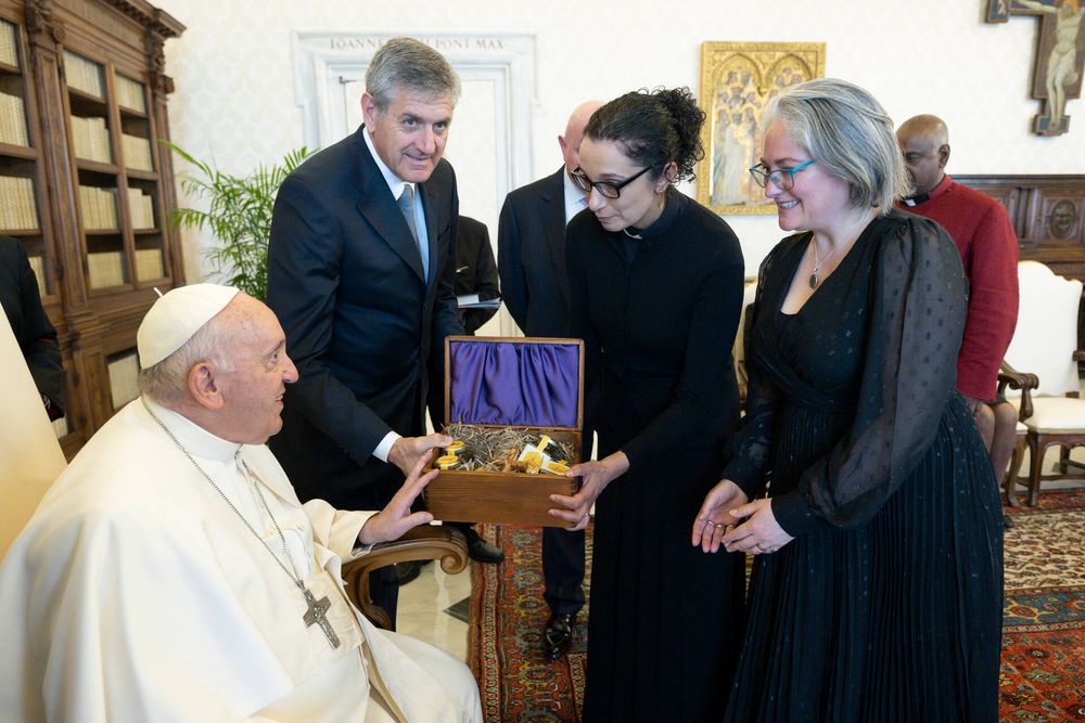 Me and colleagues offering gifts from Manchester - I am handing the Holy Father a box with honey from the Manchester cathedral bees 