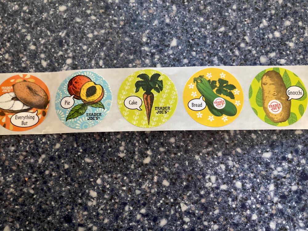 Stickers of picture with words on them: bagel and ‘everything but’ and a peach and ‘pie’ and carrot and ‘cake’