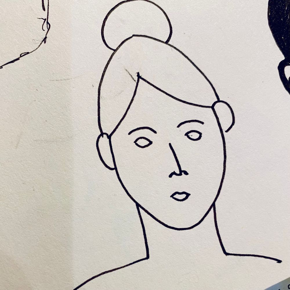 Simple ink drawing done in a few lines of a feminine face with her hair up in a bun. 