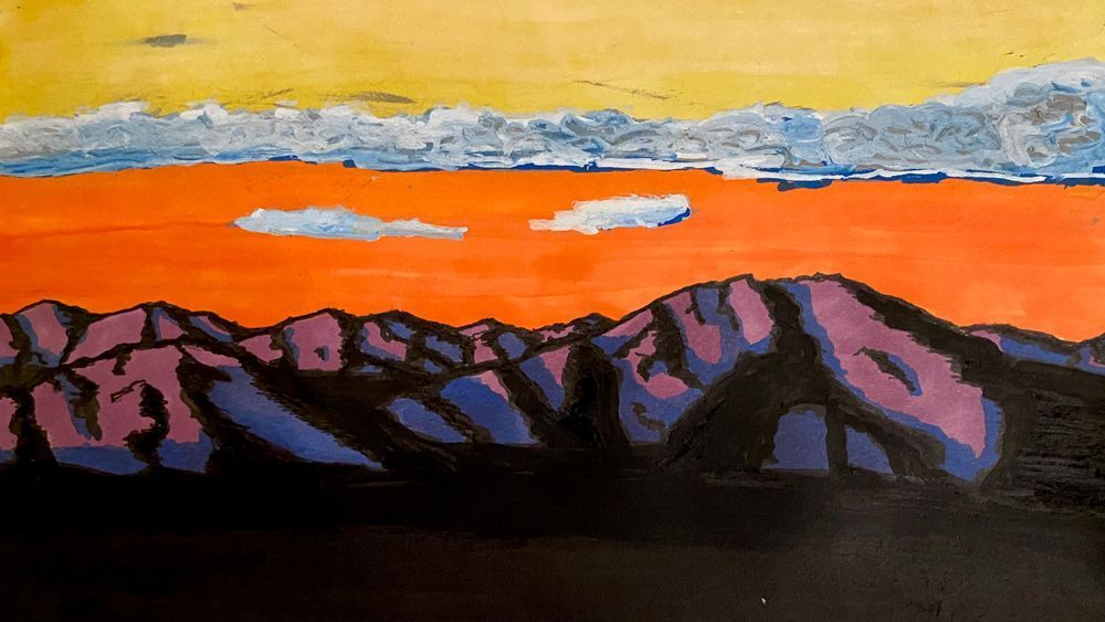 Mixed media drawing of a mountain range at around sunset. The light is hitting the sides of the mountains, but shadow has crept over much of the landscape. 