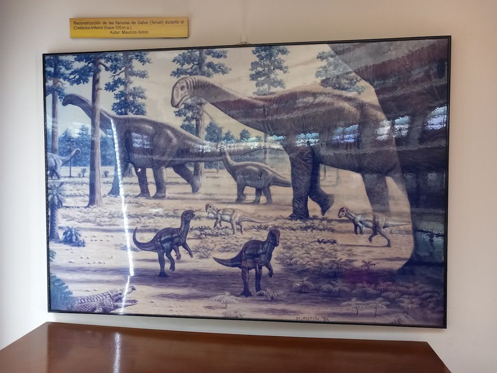 Painting on the wall "Reconstruction of the lower cretaceous of Teurel" by Mauricio Anton, depicting various dinosaursas