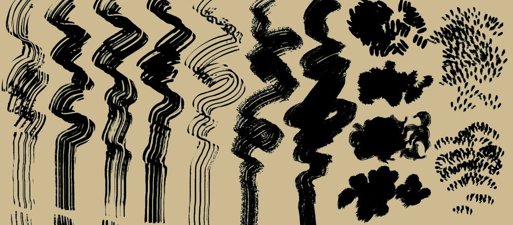 Samples of the brushes included in the set, rough strokes in inky black on a beige background.