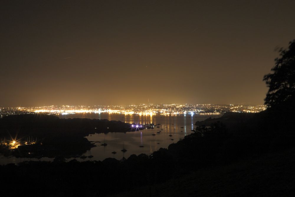 Artificial skyglow: City from a distance with lots of anthropogenic light and light dome