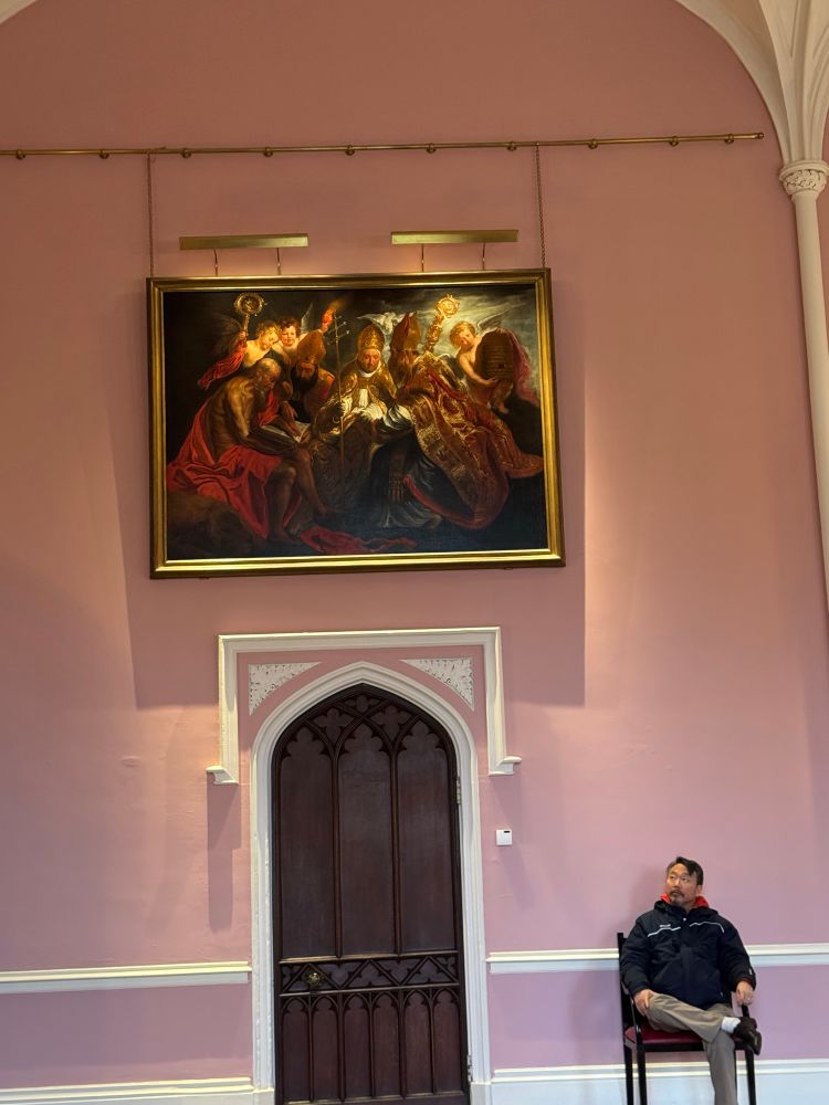 Cardinals hobnob with a naked saint and angels in a painting in the Bishop’s Palace Throne Room in Bishop Auckland— Sheeyun side-eyes it