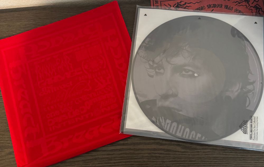 rawfear variant of the breach picture discs showing the josh side. the red velvet breach vinyl sleeve was also included 