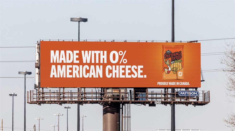 Billboard for cheestrings snacks reading "MADE WITH ZERO PERCENT AMERICAN CHEESE"