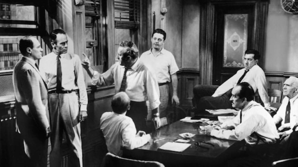 Still of jurors arguing from the movie 12 angry men. 