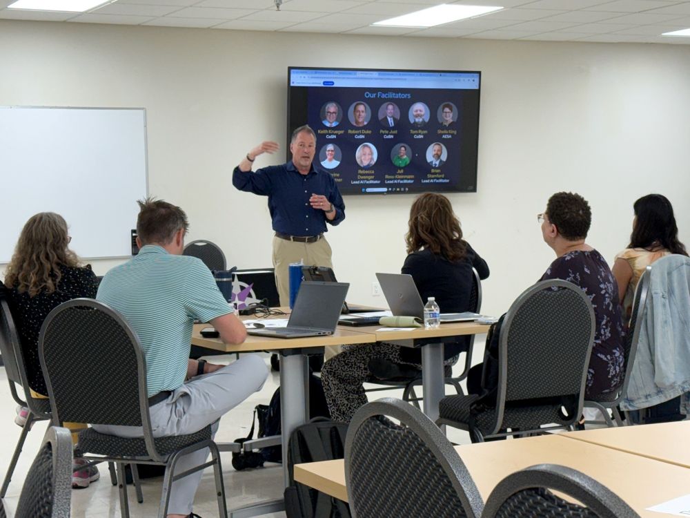 Pete Just, one of CoSN's facilitators, shares and trains Regional Trainers in Minneapolis, as they came together to build their skills in using generative AI in K-12 education. They are now equipped to support districts in evaluating their AI readiness with the CoSN/CGCS GenAI Maturity Tool. 