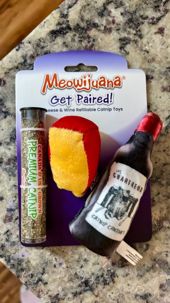 Picture of a wine and cheese catnip toy called “meowijuana” and it says “get paired!”