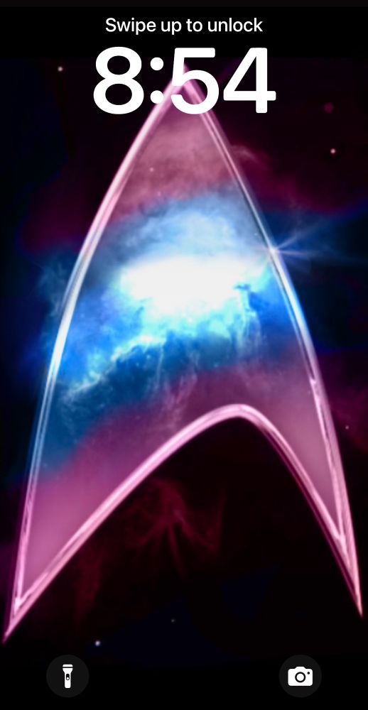 My Lock Screen which is the Star Trek delta in the trans flag colors 