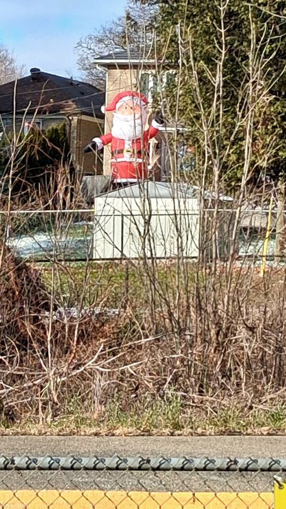 Santa ornament in back yard.