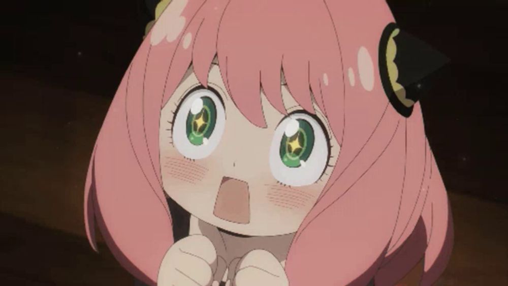 a cartoon girl with pink hair and green eyes