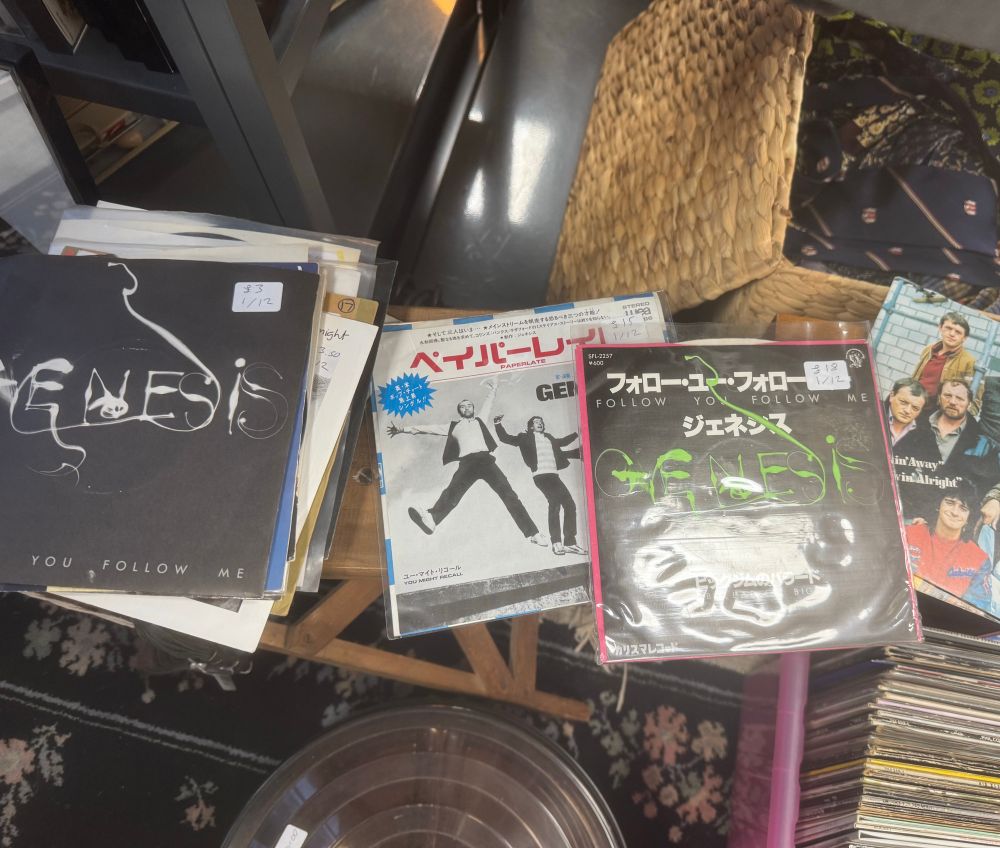 Records in a charity shop, including some Japanese import singles.
