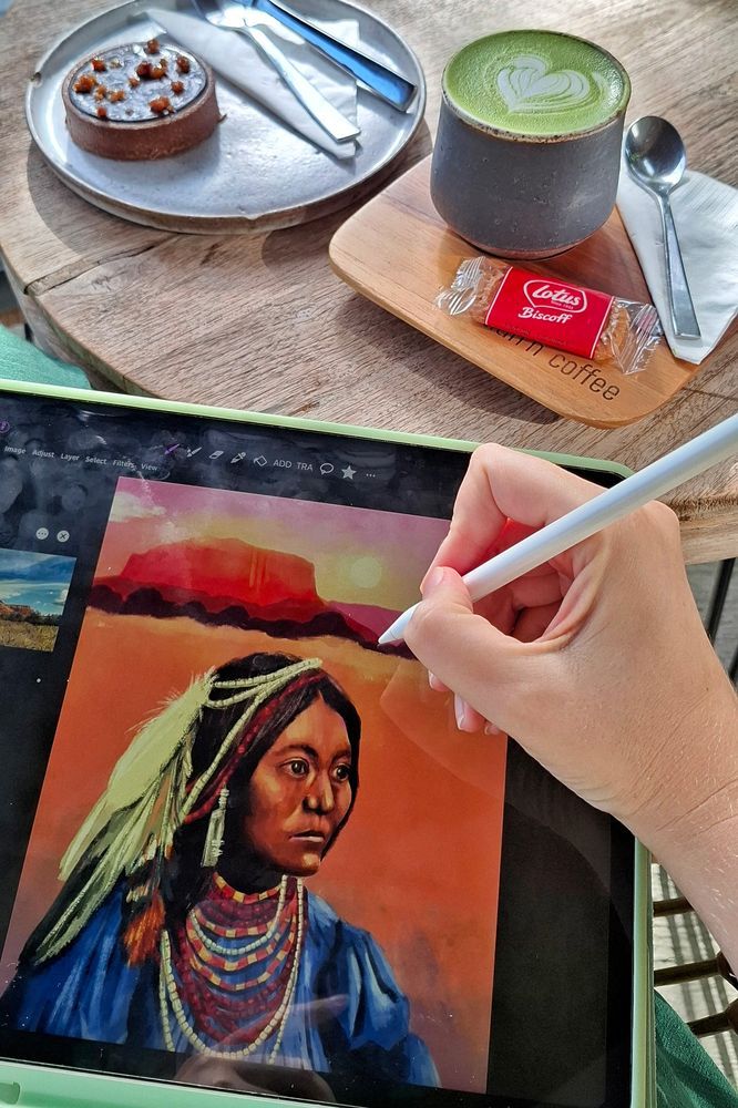 Yes, I'm still creating art too. Here's me working on a recent portrait of Lozen, an inspiring Native American woman, and a yummy matcha latte and a chocolate tart (aka food for the soul 😅)