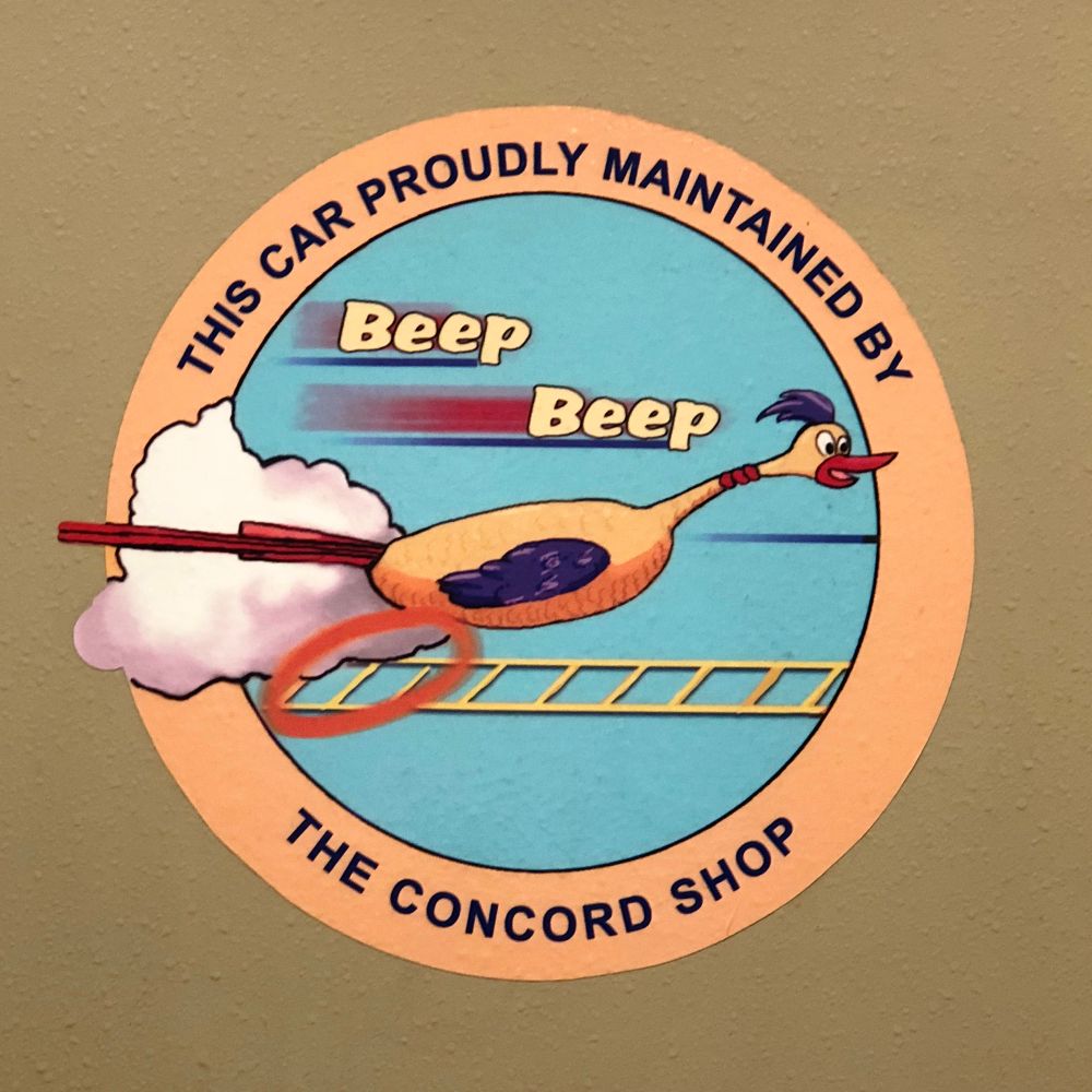 Roundel sticker depicting a roadrunner bird with wheels for legs and feet, saying “Beep Beep” while speeding past. The roundel says: “This Car Proudly Maintained by the Concord Shop”