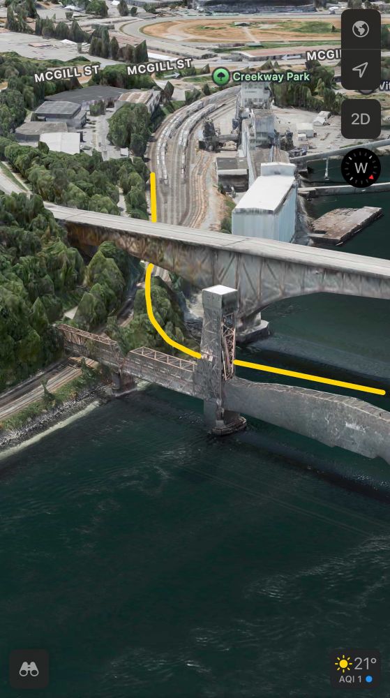 Apple Maps 3D view of the CP mainline passing under the Second Narrows bridges, overlaid with the author’s conception of a flyover from the CP mainline, under the Ironworkers Memorial road bridge, to a new rail bridge following the alignment of the original 1925 bridge.