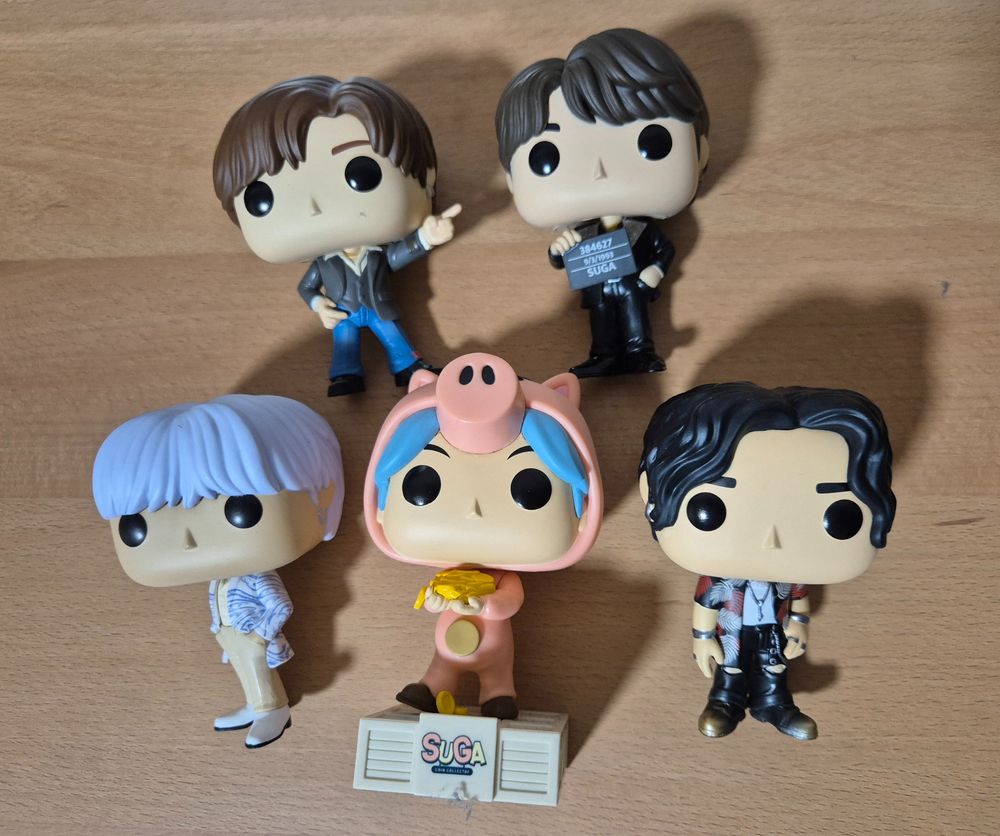 A photo of 5 Suga Funko pop. Top row - Dynamite and Butter. Bottom row - Proof, Hamm and Haegeum 