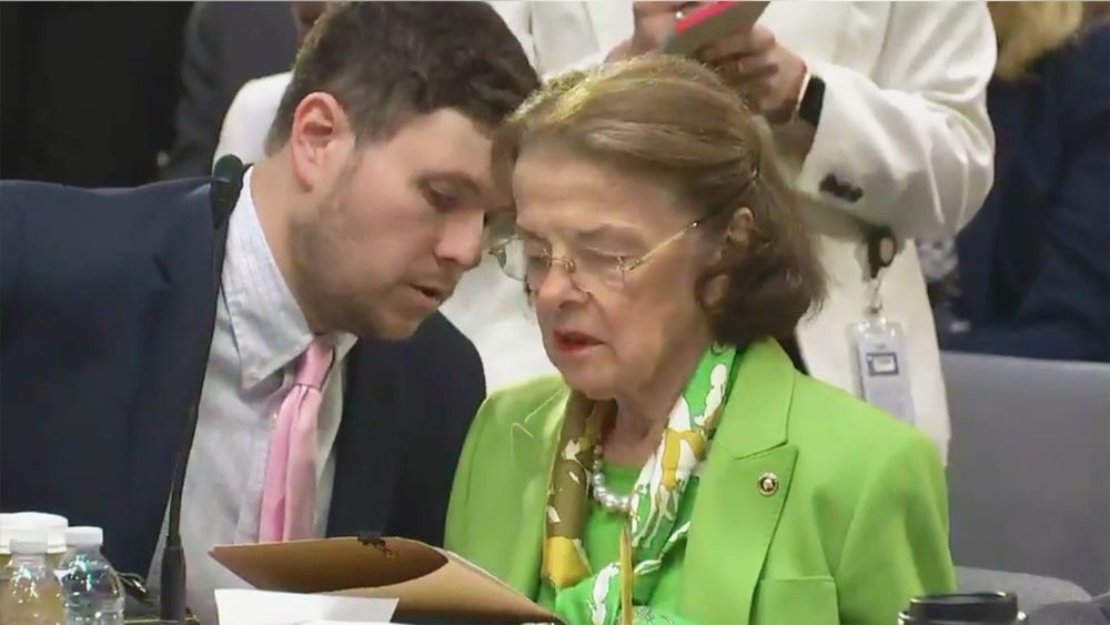 Dianne Feinstein being told to simply "vote yes" instead of babbling on about why she supports the bill. She was too old and out of her mind to understand what she was doing and what was happening around her.