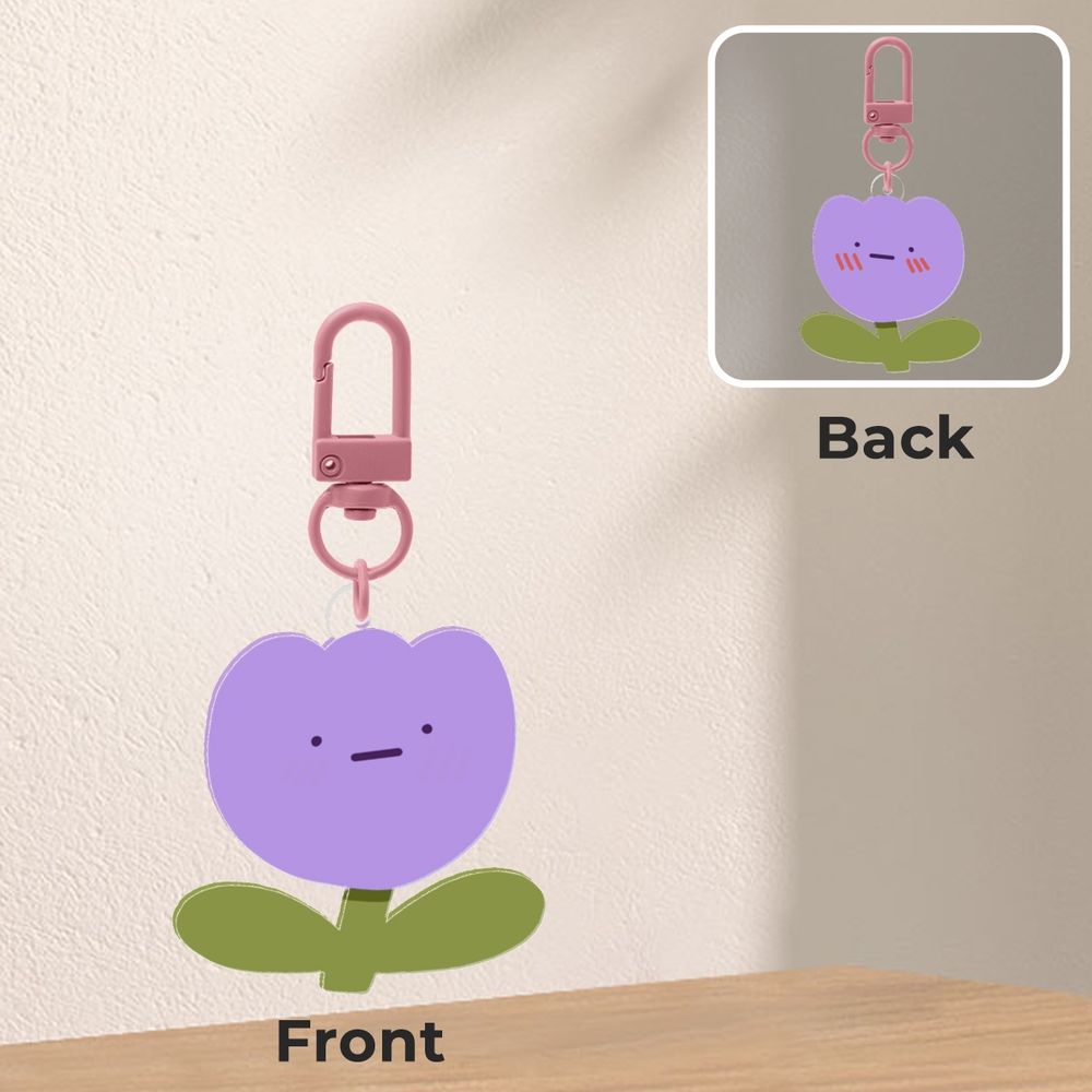 a keychain preview of a flower with a stoic face, the other side is them, blushing