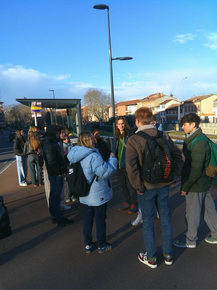 Students at a bus stop