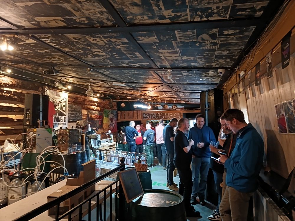 A scatter of sour beer fans supping