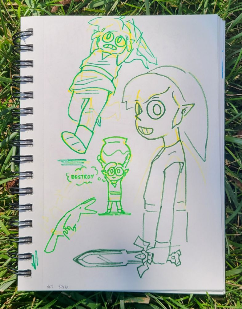 A sketchbook sitting in the grass filled with drawings of toon link from legend of zelda