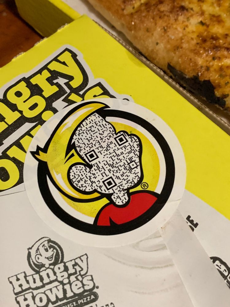 the hungry howie mascot has his entire face replaced with a massive qr code texture