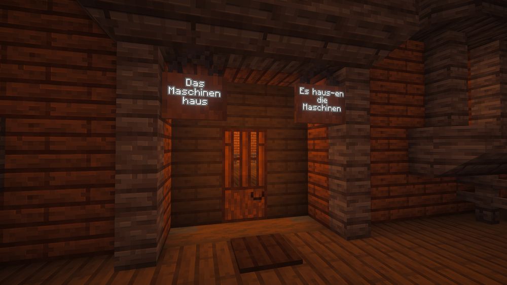 Screenshot from Minecraft of the outside of the front entrance to an ornate house built with modded blocks. Two hanging signs to either side of the front door read: "Die Maschinenhaus" (The Machine House) and "Es haus-en die Maschinen" (It house-en the machines).