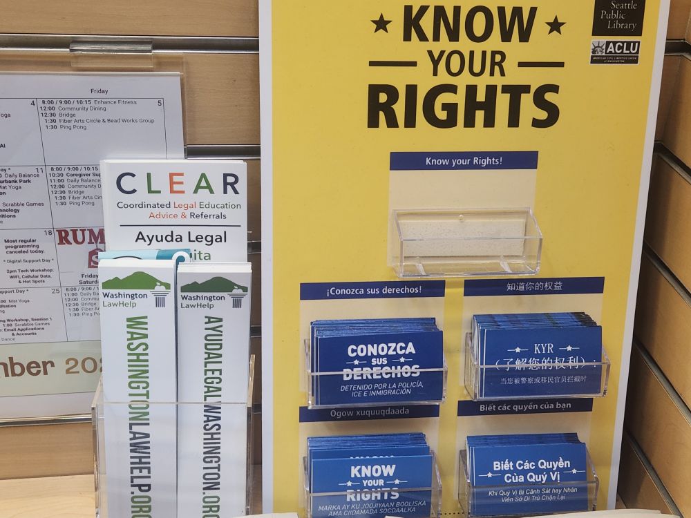 A "Know Your Rights" display and information about where to get legal representation at a public library. In multiple languages.