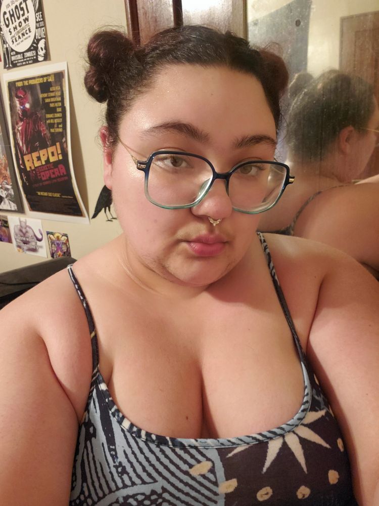 A selfie. I have my hair in space buns and I am wearing a celestial jumpsuit.