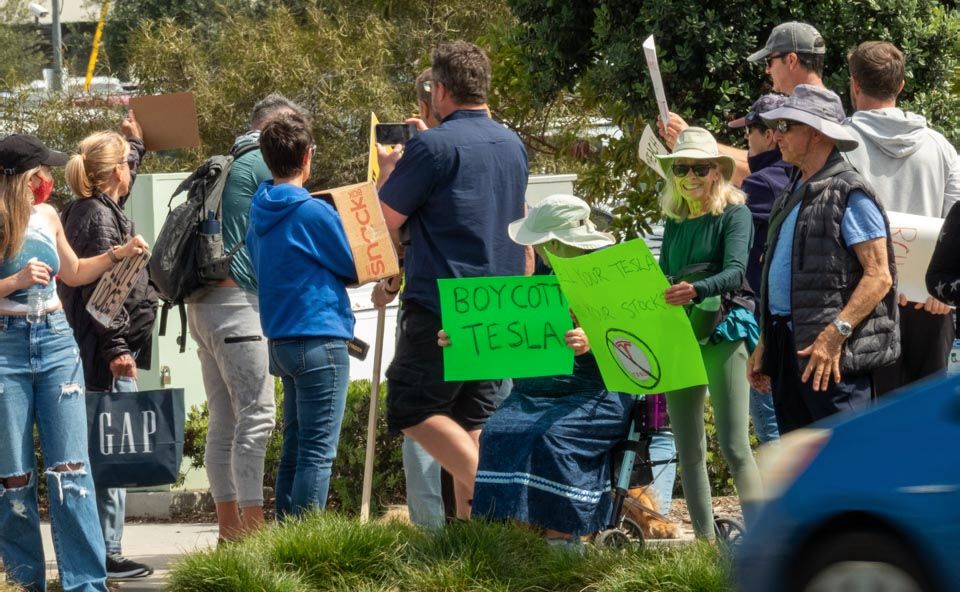 More signs and protesters.