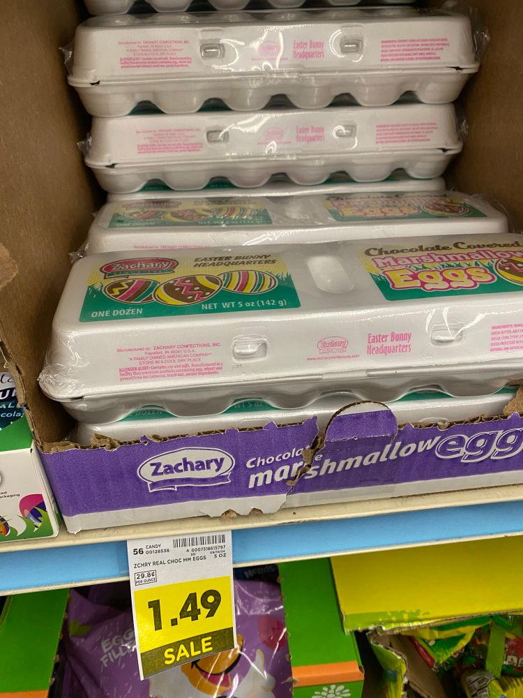 Grocery shelf with chocolate marshmallow eggs on sale for $1.49 a dozen