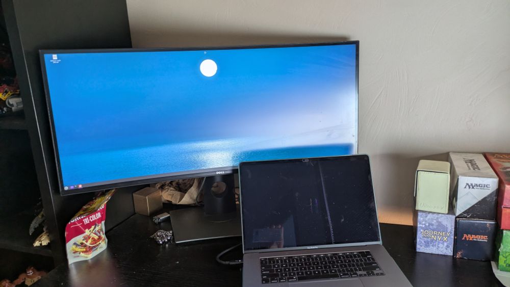 2019 macbook pro with a broken screen running Linux mint via a ultrawide display + docking station