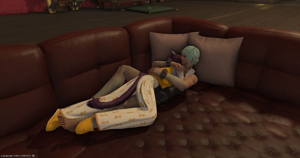 a zoomed out version of the last photo, where you can see sicard has his bare feet out on a communal couch because he doesn't care