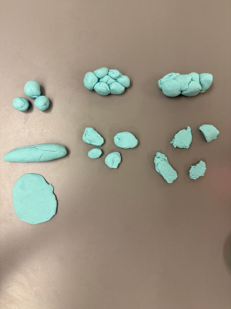 The stages of the Bristol stool chart made of play doh.