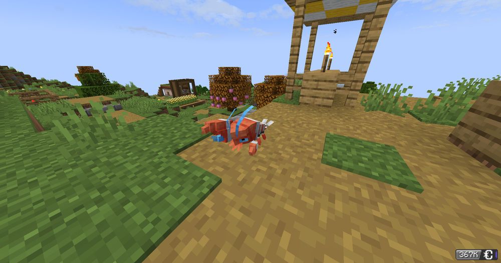 A screenshot of minecraft with cobblemon, showing a Shiny Clauncher on a dirt path, it is Red as opposed to the usual blue.