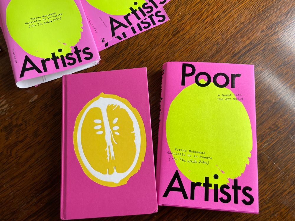 the hardback of poor artists which has bright pink cover and yellow lemon graphic on the front, and then the inside of a lemon under the sleeve 