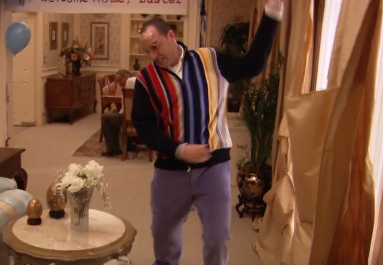 buster bluth from arrested development about to smash a flower vase
