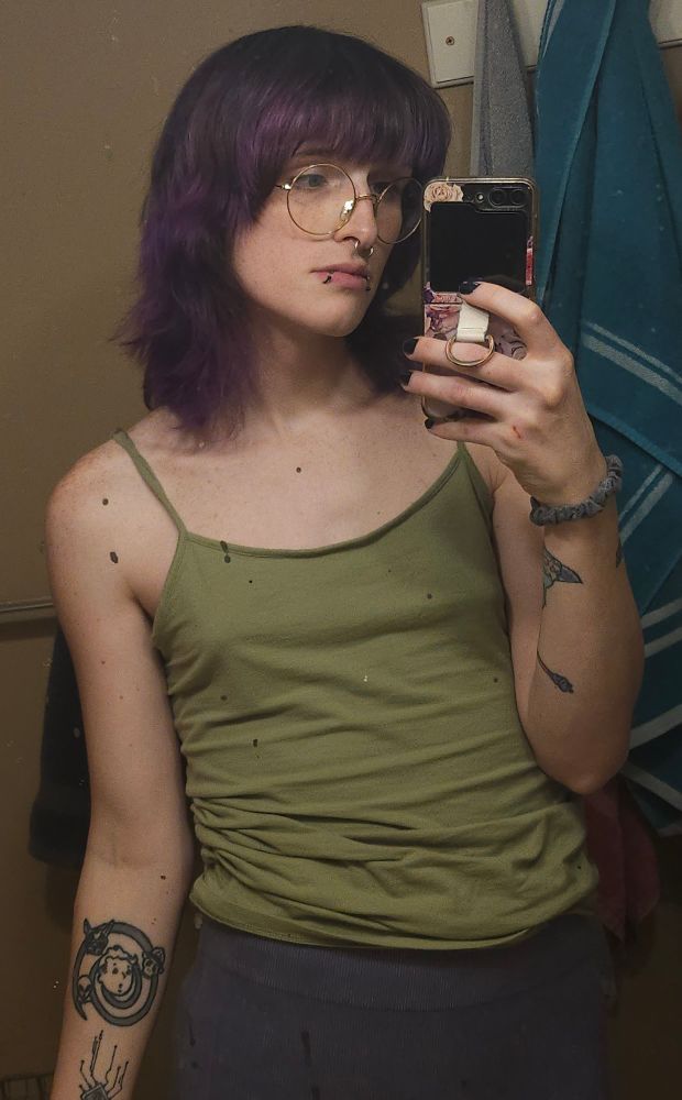 woman looking eagerly into mirror 