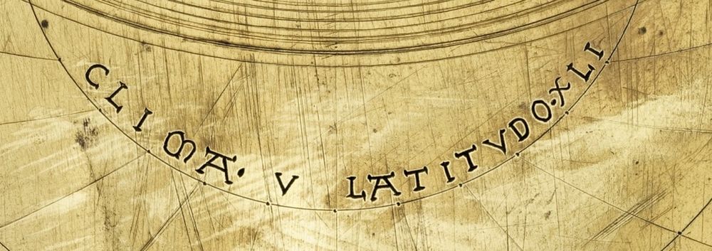 Detail of a latitude plate of a medieval astrolabe at Merton College Oxford, with the inscription CLIMA· V   LATITVDO·XLI.