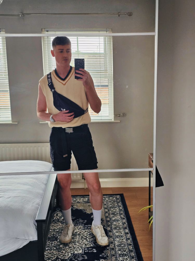Me in a sleeveless sweater vest, cargo shorts and a whole load of fake tan on me. 
