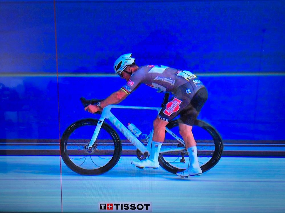 Mathieu van der Poel crosses the finish-line in Roubaix already dismounting his bicycle. 